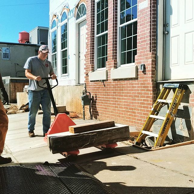 image of worker delivering wood panels