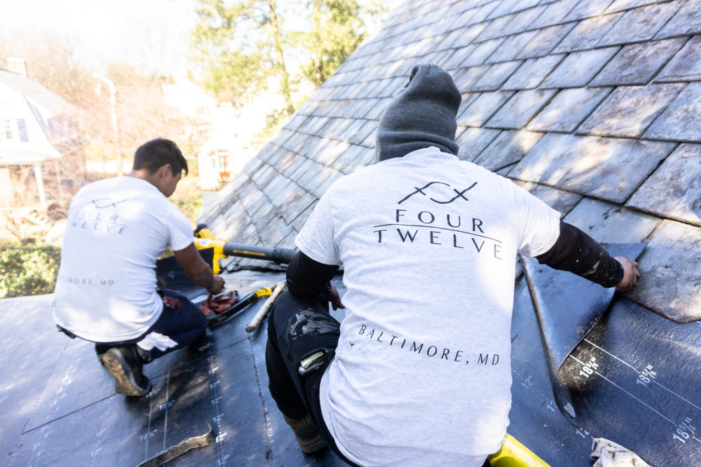 Four Twelve roofers on shingle roof