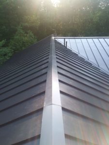 A standing seam metal roof with different length panels