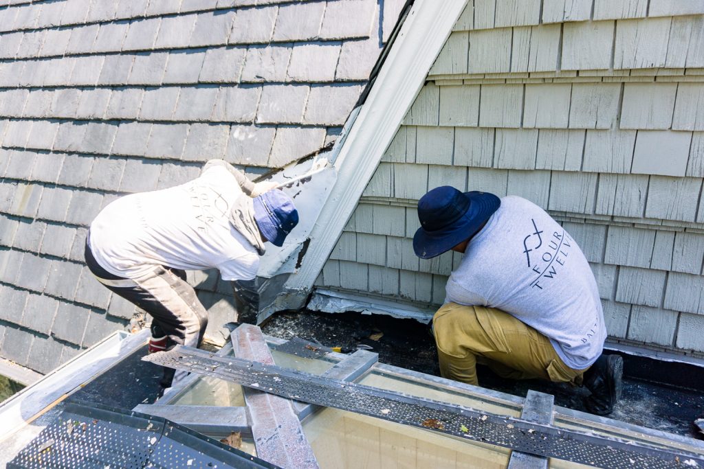 Four Twelve roofers conducting repairs